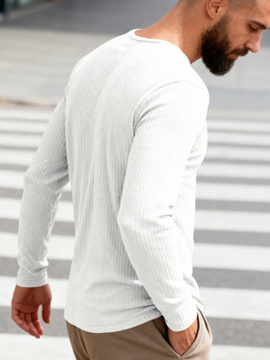 White ribbed long sleeve t-shirt with crew neck on a man.