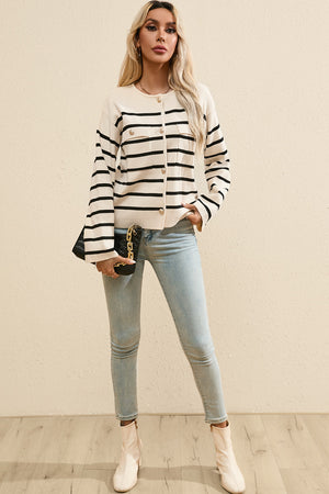 Beige knit cardigan with black nautical stripes, button-up front, and chest pockets.