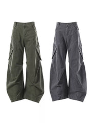 Textured paneled cargo pants in army green and dark gray with baggy fit and large pockets.