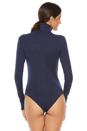 Sculpted ribbed turtleneck bodysuit in dark blue with long sleeves.