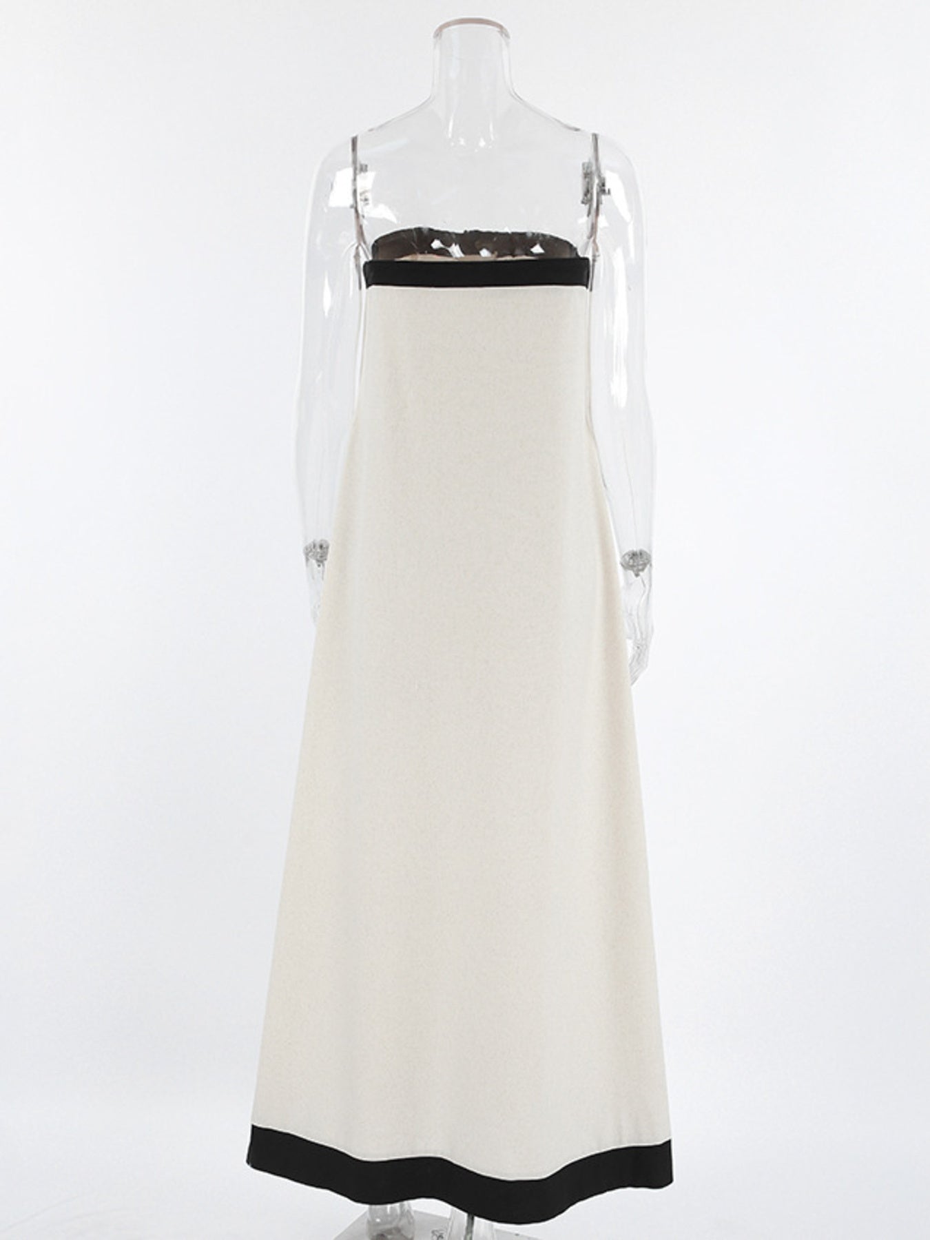 Beige cotton blend tube maxi dress with black trim and spaghetti straps.