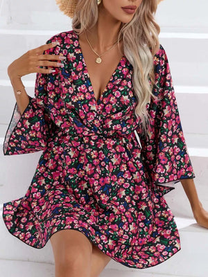 Floral ruffle hem mini dress with a V-neck and flutter sleeves.