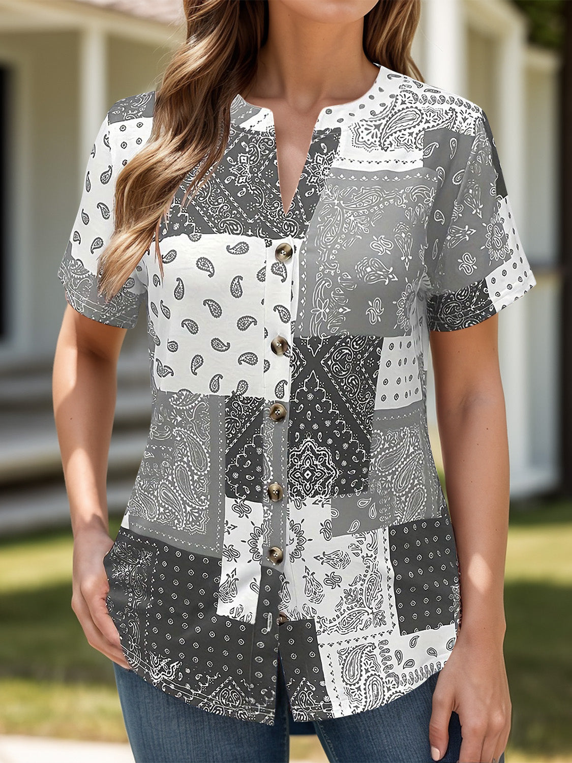 Gray bandana patchwork henley blouse with button front and short sleeves.