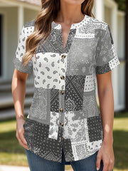 Gray bandana patchwork henley blouse with button front and short sleeves.