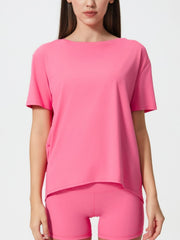 Relaxed fit performance tee in Fuchsia Pink with short sleeves and boat neck.