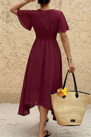 Burgundy V-neck flutter sleeve midi dress with smocked waist and a-line skirt.