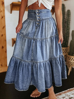 Tiered denim maxi skirt in medium wash with button front and ruffled hem