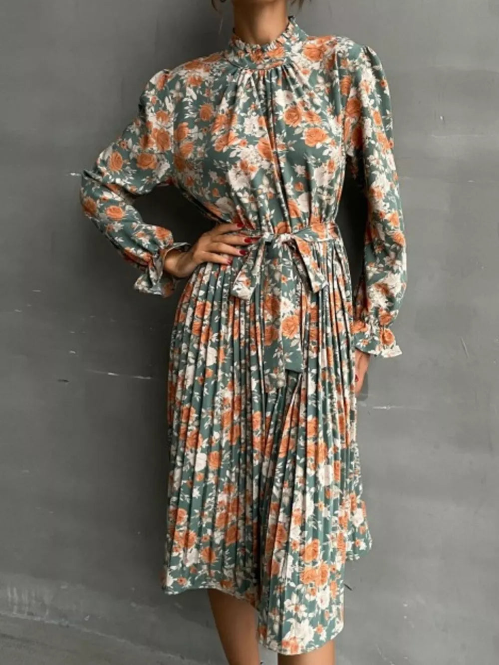 Green floral midi dress with tie waist and pleated skirt