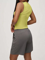 Yellow ribbed button-front fitted tank top with a mock neck, shown from the side.
