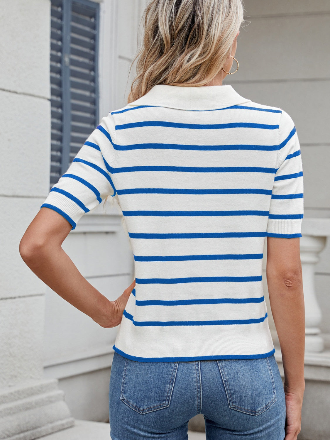 Nautical stripe polo knit top in sky blue and white, short sleeves, collared neckline.