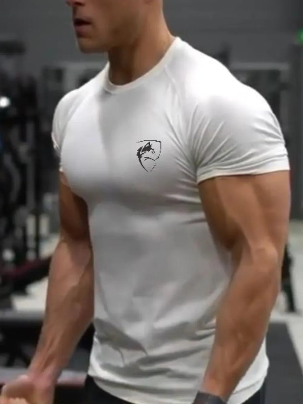 White performance raglan tee with black emblem on chest