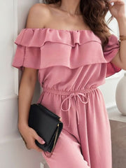 Dusty pink off-shoulder ruffle palazzo jumpsuit with drawstring waist.