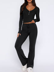 Black ribbed loungewear set with henley crop top and drawstring flare pants