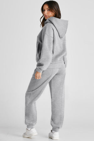 Gray relaxed fit lounge set with seam detail on hoodie and joggers.