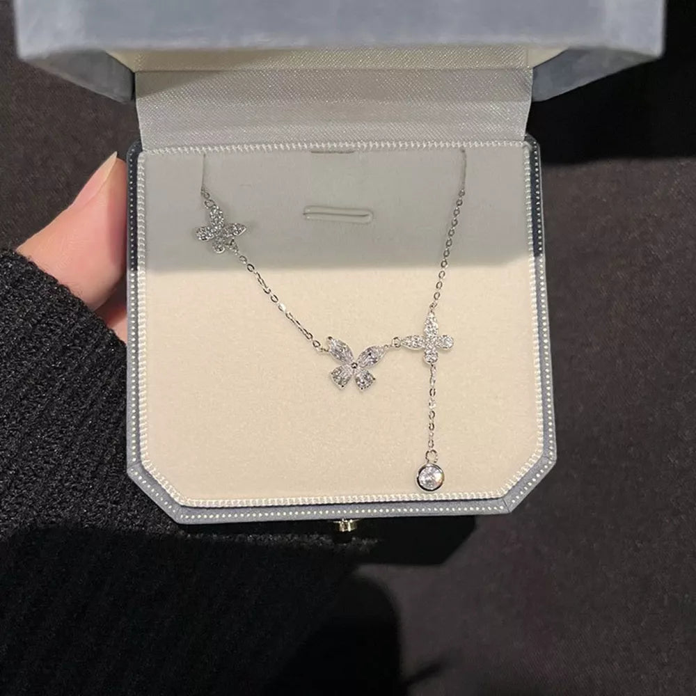 Elegant butterfly zircon necklace in silver, 925 sterling, delicate charm with dangling crystal.