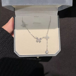 Elegant butterfly zircon necklace in silver, 925 sterling, delicate charm with dangling crystal.