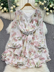 White floral ruffle hem wrap mini dress with cinched waist and balloon sleeves.