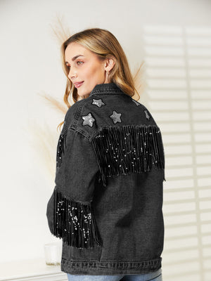 Black denim trucker jacket with star patches and sequin fringe on back and sleeves.