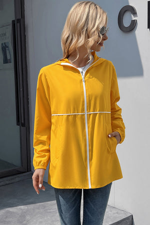 Yellow hooded rain coat with white zipper and trim, full zip, pockets