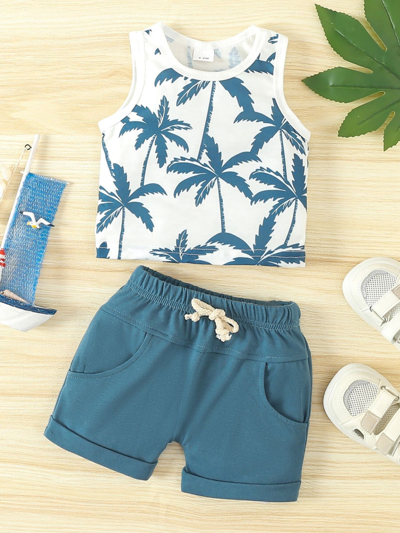 Baby tank top and shorts set with tropical palm print and drawstring shorts in sky blue cotton.