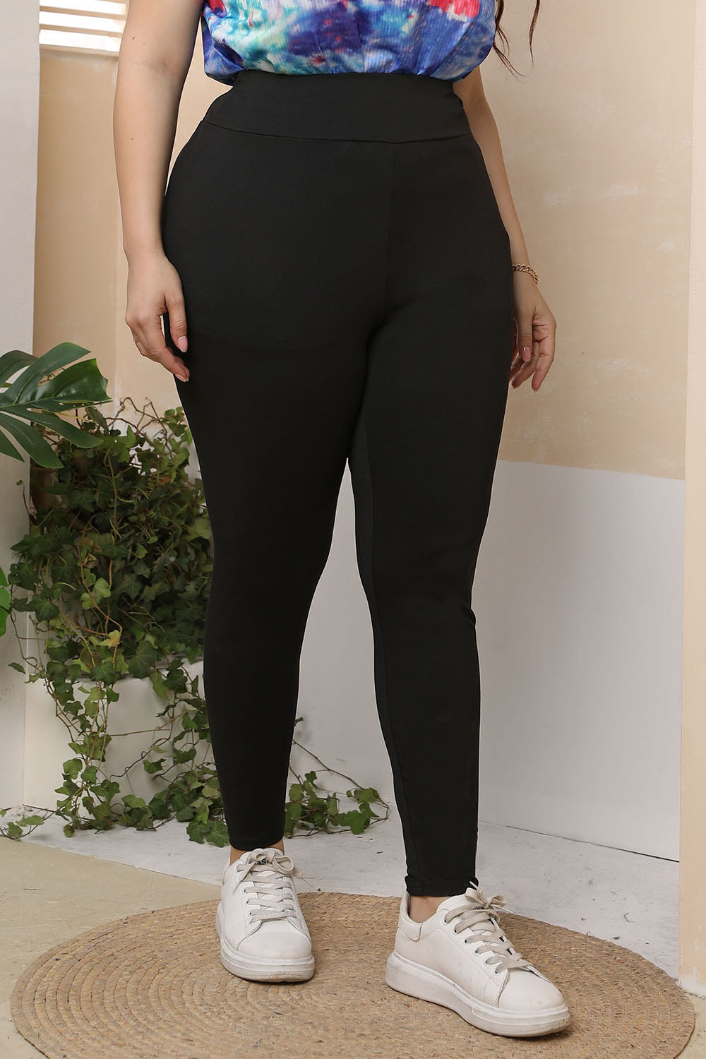 Black textured sculpting leggings with a high waist and full length.