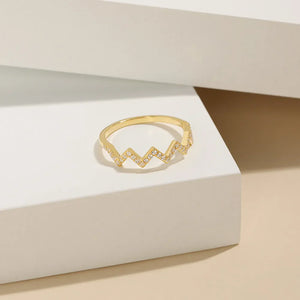 Gold zigzag pavé band ring with clear stones