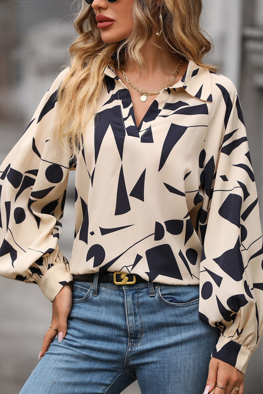Cream geometric print blouse with voluminous sleeves and V-neck