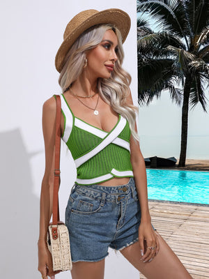 Green knit crossover tank top with white contrast trim and crisscross straps.