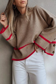 Mocha ribbed knit pullover sweater with red trim detail and button cuff sleeves.