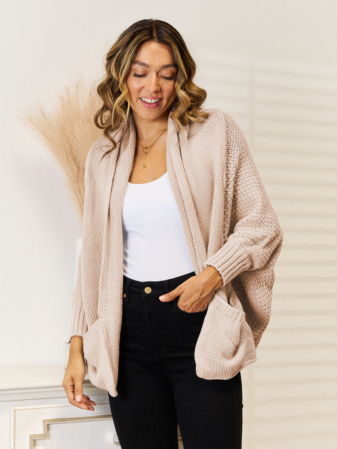 Cocoon knit cardigan in tan with pockets and a relaxed fit.
