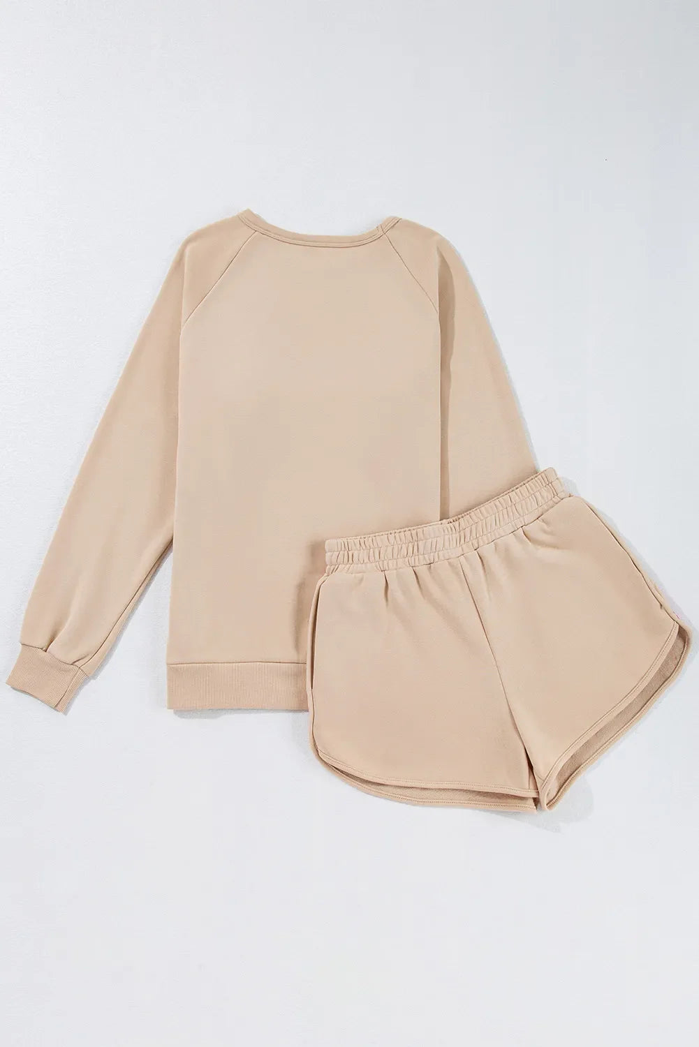Tan loungewear set with crewneck sweatshirt and dolphin shorts