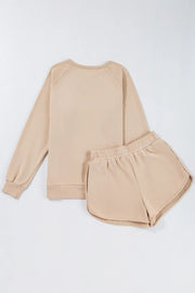 Tan loungewear set with crewneck sweatshirt and dolphin shorts