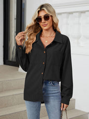 Black corduroy overshirt with button front and chest pockets, styled casually.