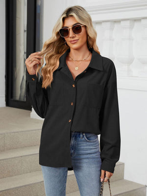 Black corduroy overshirt with button front and chest pockets, styled casually.
