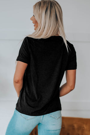 Black t-shirt with rolled sleeves and a graphic detail on the back.