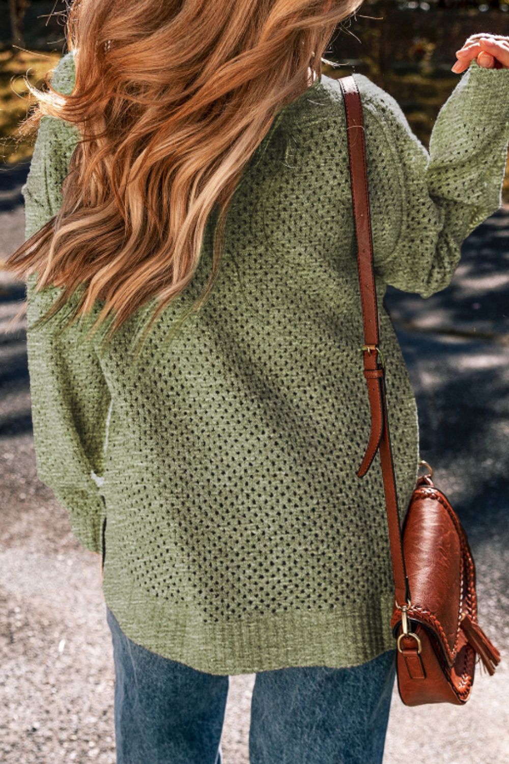Open-knit slouchy V-neck sweater in matcha green with long sleeves.