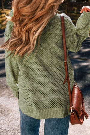 Open-knit slouchy V-neck sweater in matcha green with long sleeves.