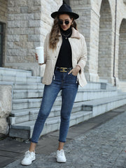 White quilted sherpa collar jacket with drawstring details and button front, worn by a model with jeans.