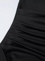 Black ruched maxi dress detail with elastane fabric.