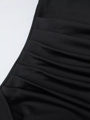 Black ruched maxi dress detail with elastane fabric.