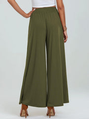 Moss elastic waist palazzo trousers with pockets and wide legs.
