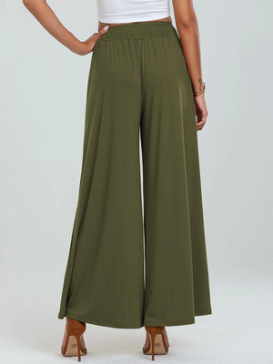 Moss elastic waist palazzo trousers with pockets and wide legs.