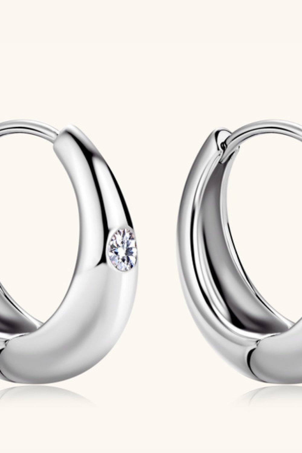 Silver hoop earrings with crystal accent, made of 925 sterling silver.