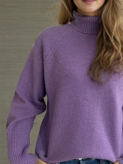 Purple ribbed turtleneck sweater with subtle sparkle details and ribbed cuffs.