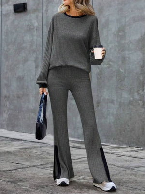 Gray ribbed knit lounge set with slit hem pants and crewneck top.