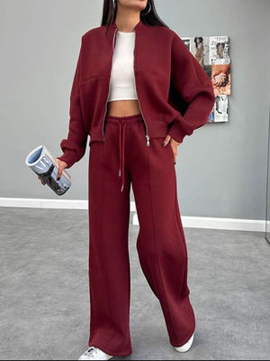 Burgundy zip-up bomber jacket and wide-leg sweatpants coord set with drawstring waist.