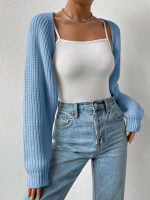 Light blue acrylic knit bolero shrug with long sleeves and ribbed details.