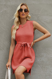 Coral belted knit tank dress with a tie waist and A-line cut.