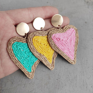 Woven heart earrings in aqua, yellow, and pink with gold posts.