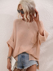 Relaxed knit tunic top in a light peach color with a boat neck and chest pocket.